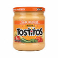 Jar of Tostitos Salsa Con Queso on a black surface