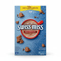 Swiss Miss milk chocolate hot cocoa mix packaging on a blue background